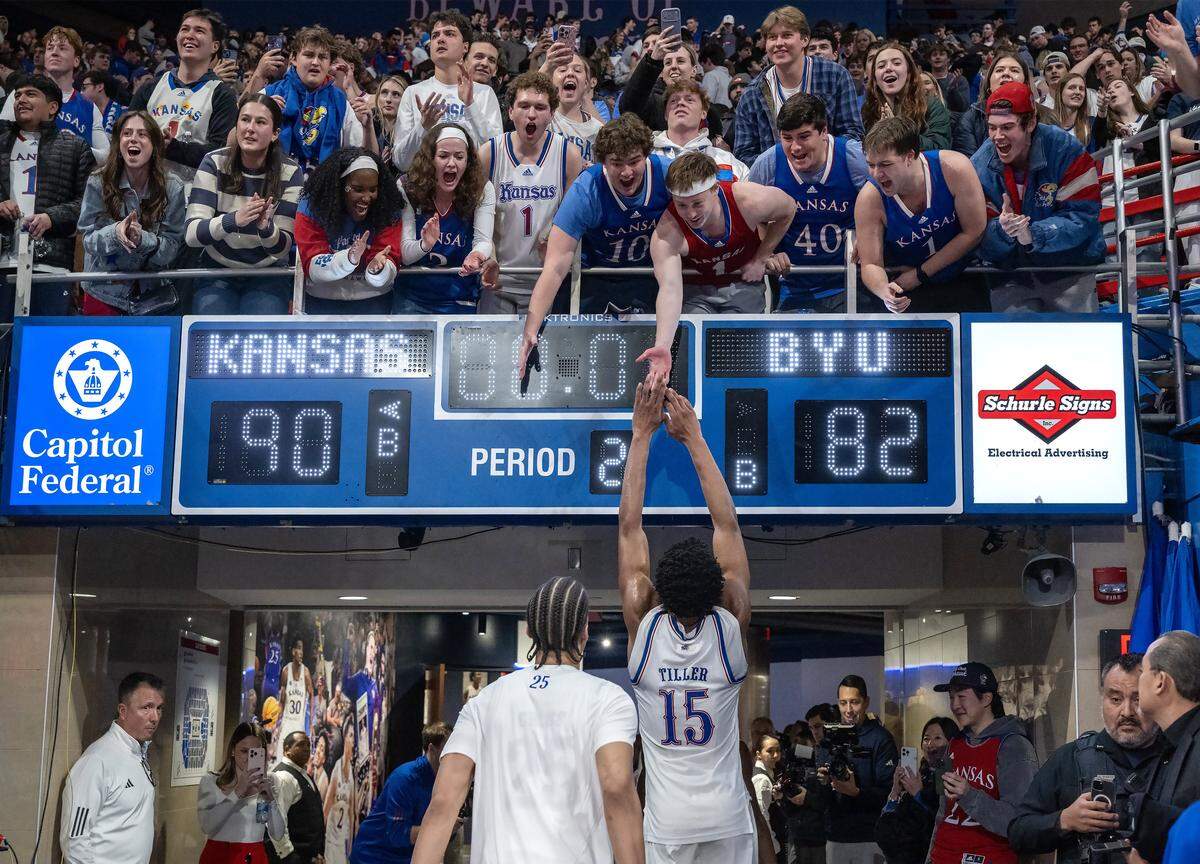 Kansas Jayhawks forward Bryson Tiller (15) is greeted by fans leaving the court after Kansas defeated BYU 90-82 in a thriller at Allen Fieldhouse on Saturday, Jan. 31, 2026, in Lawrence.