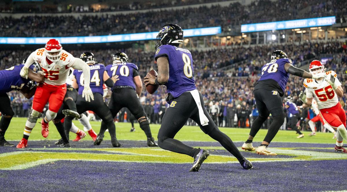 Baltimore Ravens quarterback Lamar Jackson (8) works the pocket in his own end zone as Kansas City Chiefs defensive tackle Chris Jones (95) gives chase during the AFC Championship Game on Sunday, Jan. 28, 2024, in Baltimore.