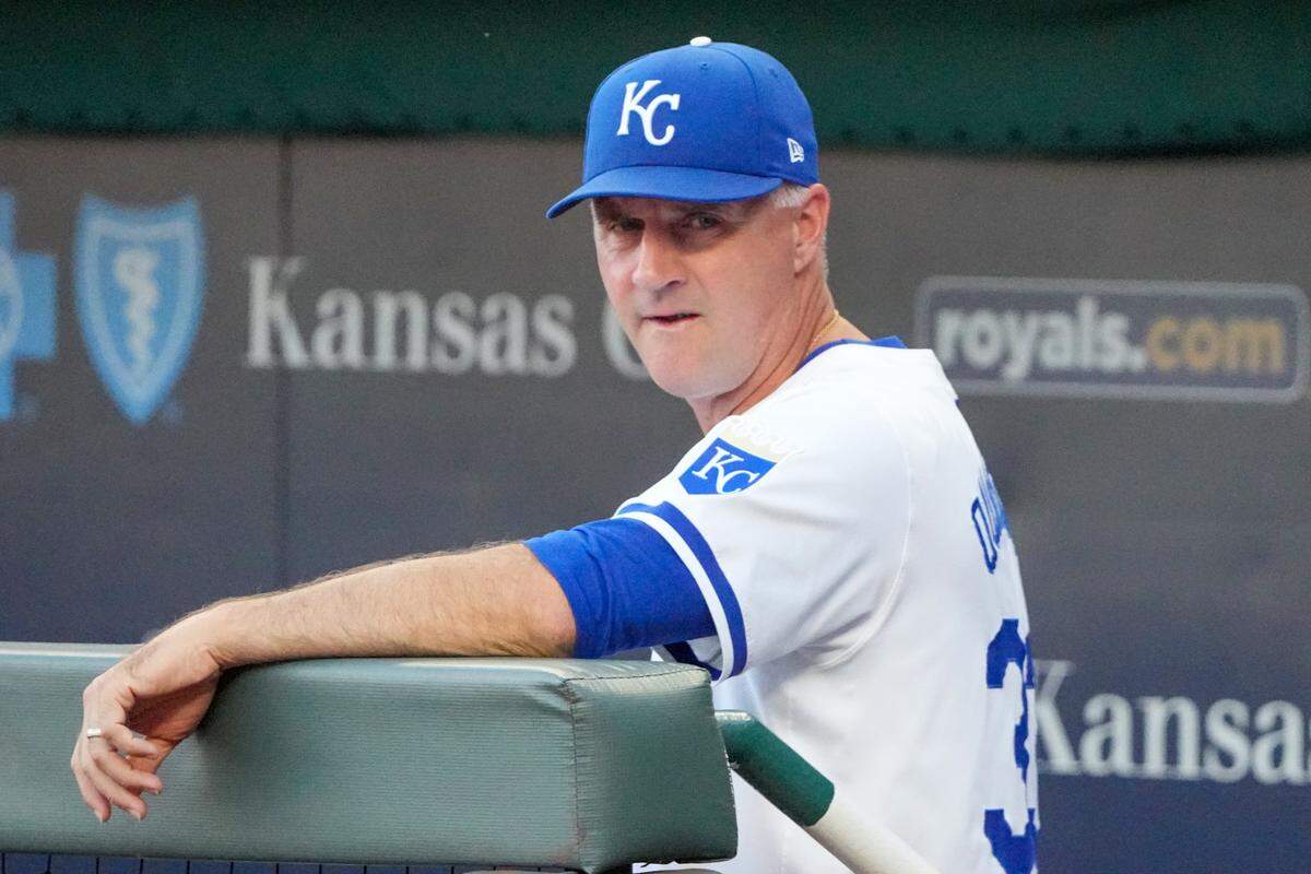 Kansas City Royals manager Matt Quatraro watches preparations for Wednesday evening’s game against the Cleveland Guardians from the dugout at Kauffman Stadium.
