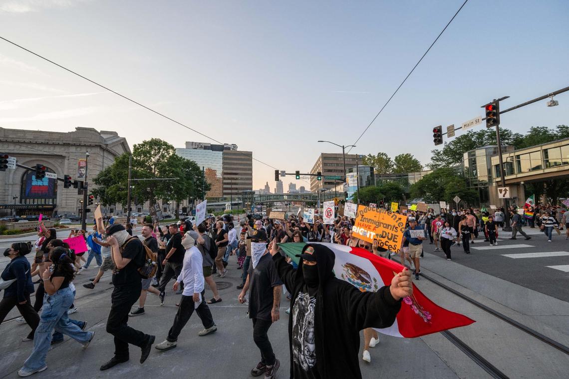 Several hundred people march across Main Street towards the Liberty Memorial during a Shut Down ICE protest on Kansas City’s Westside and downtown areas on Tuesday, June 10, 2025. People held signs and flags and chanted in support of immigrants and against the Trump administration’s immigration policies.
