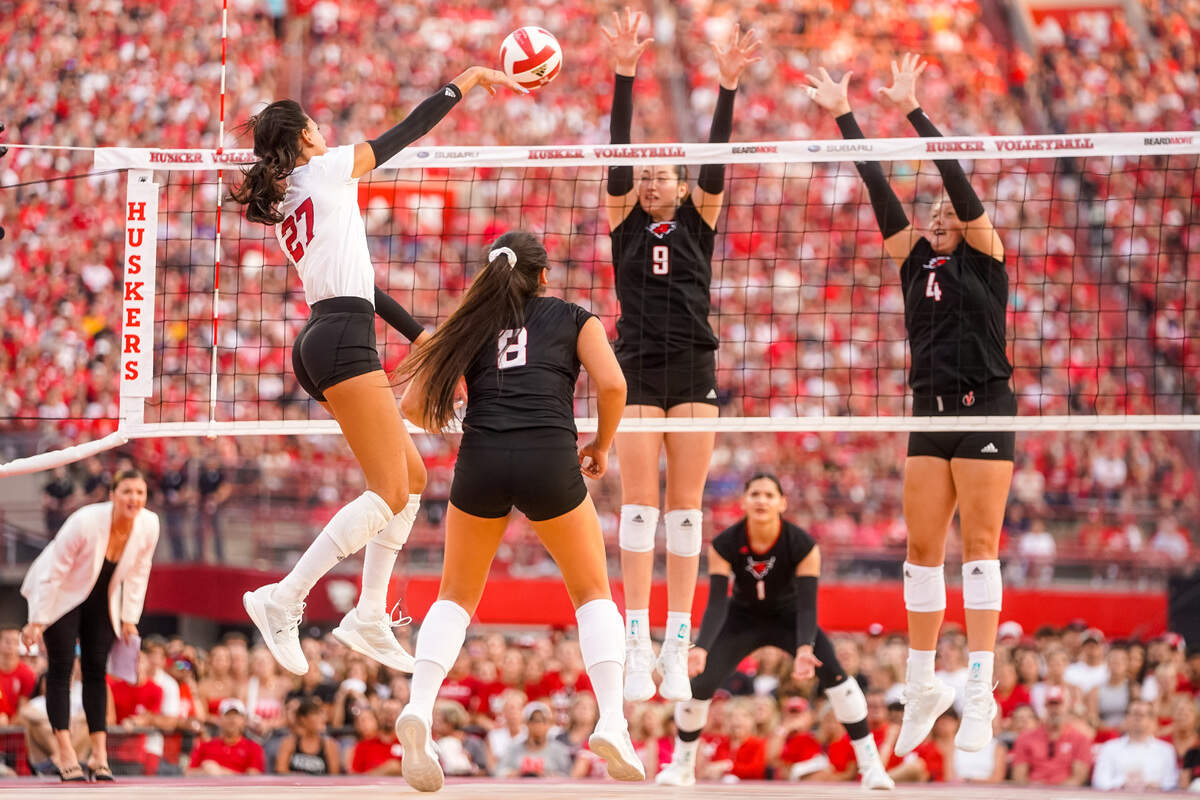 Nebraska Cornhuskers outside hitter Harper Murray (27) attacks the ball against the Omaha Mavericks during the first set at Memorial Stadium.