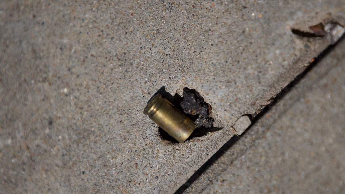 A bullet casing is seen on the sidewalk at 19th and Vine streets on Saturday, June 20. Police said several people were injured and one man was killed in a shooting in the area the night before.