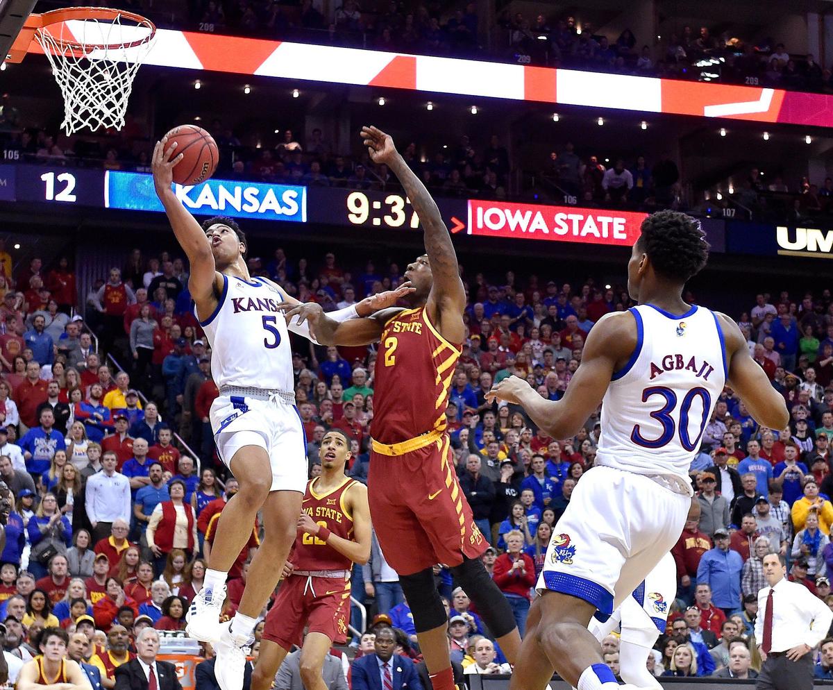 KU’s Quentin Grimes got this acrobatic reverse to fall after getting past ISU’s Cameron Lard during the first half of Saturday’s Big 12 Tournament championship game at the Sprint Center.