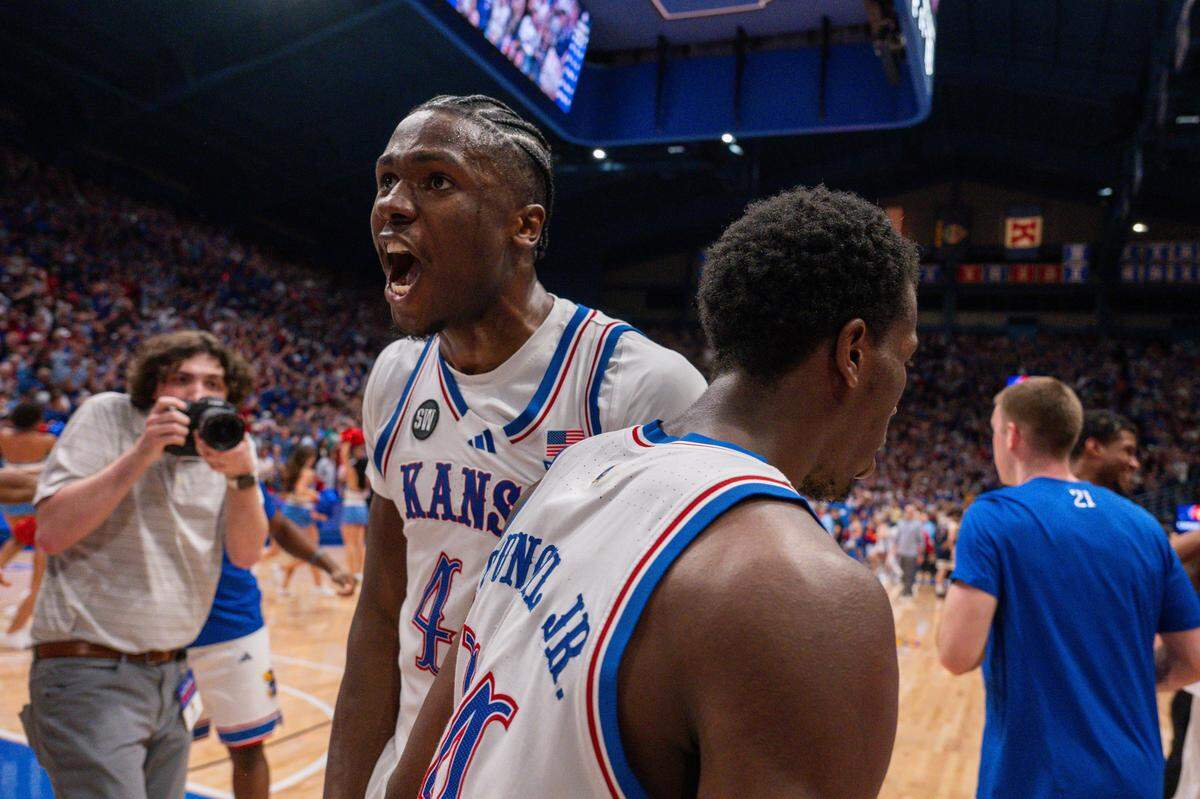 Kansas Jayhawks forward Flory Bidunga (40) shouts and chest bumps guard Melvin Council Jr. (14) on the court following a win vs. the Arizona Wildcats on Monday, February 9, 2026, at Allen Fieldhouse.