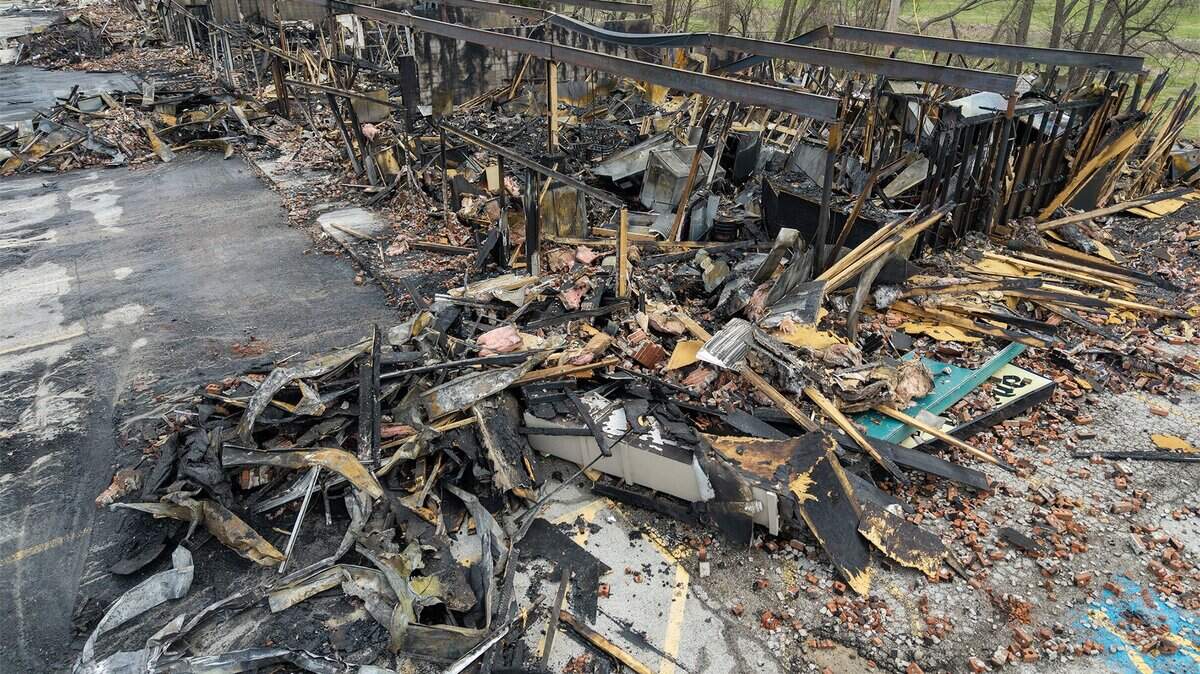 The skeletal remains of a Smithville shopping center stand in ruin on Tuesday, March 31, 2026, less than 24 hours after a massive fire destroyed five businesses. The Monday afternoon blaze destroyed Smithville's Pizza Shoppe, La Fuente Mexican Restaurant, H&R Block, Westlake Chinese Restaurant, and Lakeside Smoke.