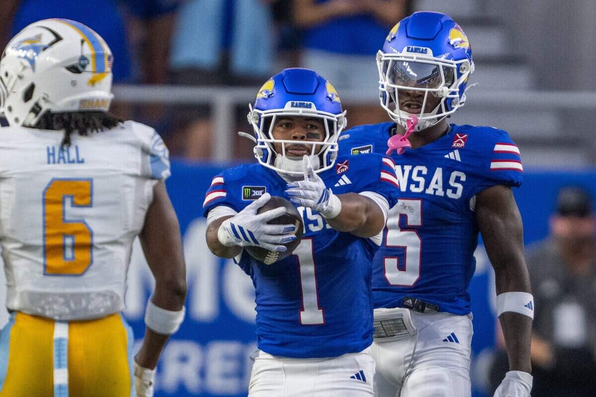 Kansas Jayhawks running back Dylan Edwards (1) signals a first down after a run in the first half of the Jayhawks game vs. Long Island University Sharks at David Booth Memorial Stadium on Friday, September 4, 2026, in Lawrence.