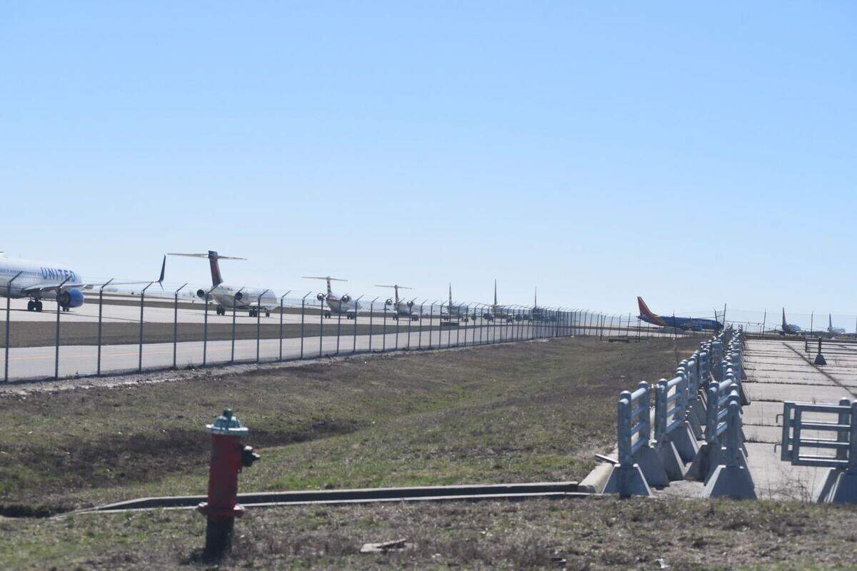 A long line of planes waits to take off as Kansas City International Airport investigates a potential threat to the terminal on Sunday, March 8.