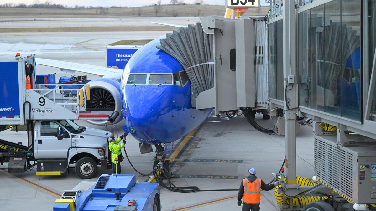 Ramp crews waited to unload the Southwest Airlines plane, which flew the first flight into the new $1.5 billion single terminal, on Feb. 28, 2023, at Kansas City International Airport.