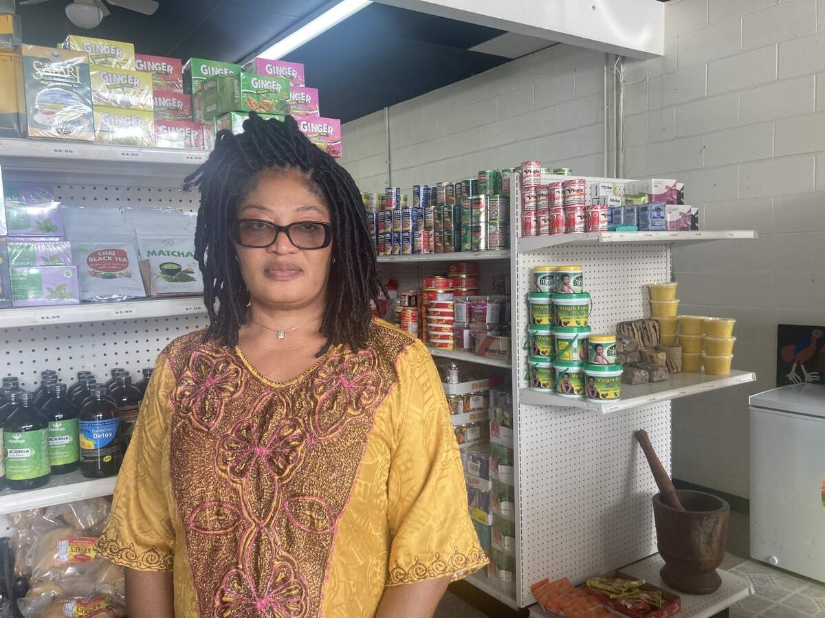Vivian Dorsaitville, owner of VJ Tropical Market, spent Saturday morning cleaning up blood in front of her market at 79th Terrace and Troost Ave. following a shooting on Saturday, June 6, 2026.