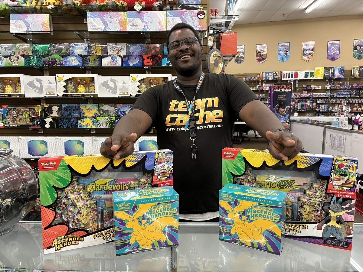 Jaylon Edwards a shift leader at Collector’s Cache in Overland Park , 13354 College Blvd, displays Pokémon card from the Ascended Heroes collection. World Cup star Memphis Depay of the Netherlands has been at the shop recently in search of two rare cards.