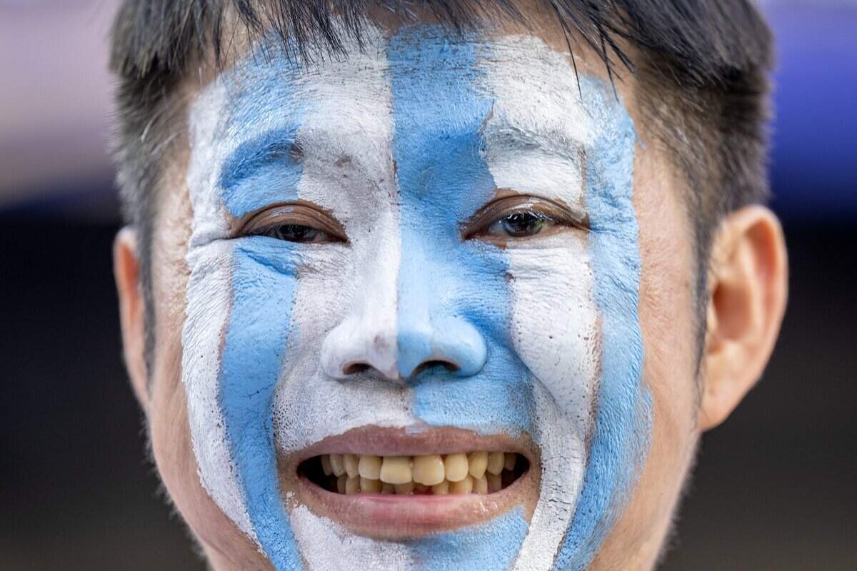 A fan with blue-and-white face paint is smiles during a FIFA World Cup quarterfinal match between Argentina and Switzerland at Kansas City (Arrowhead) Stadium on Saturday, July 11, 2026.