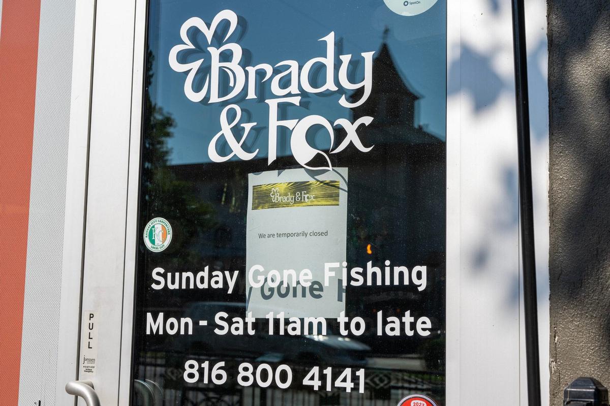 A sign reading “We are temporarily closed” is posted on the door of Brady & Fox on Thursday, Aug. 29, in Kansas City. The closure follows the death of Shaun Brady, the restaurant’s owner, was shot and killed Wednesday night.