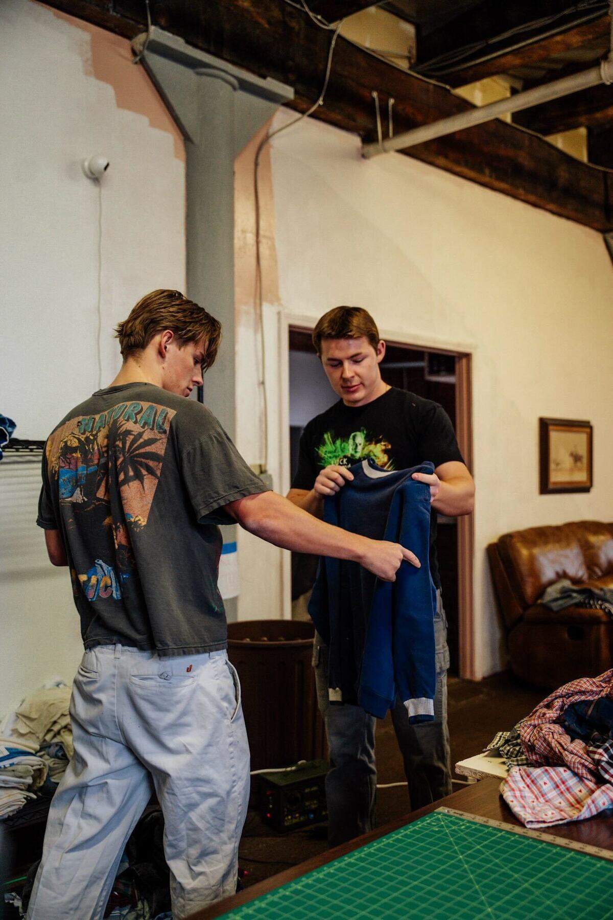 Reade Rex (left) and Thomas Rex (right) sort through their inventory.