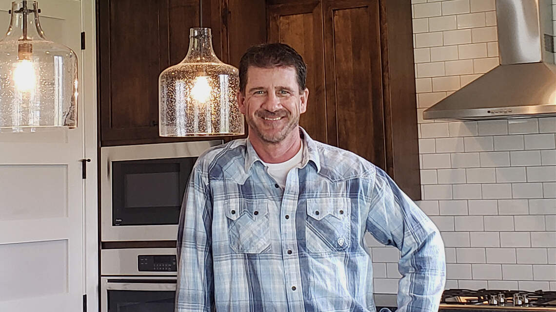 Dave Hogan at home building houses
