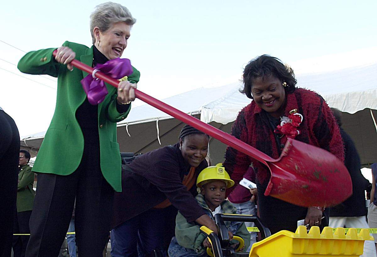 In this 2001 file photo, at a groundbreaking for the Transit and Child Development Center, 39th Street and Troost Avenue, Mayor Kay Barnes shoveled dirt into a toy loader run by Diavia Tabron, 4, as Councilwoman Mary Williams-Neal (right), assisted.
