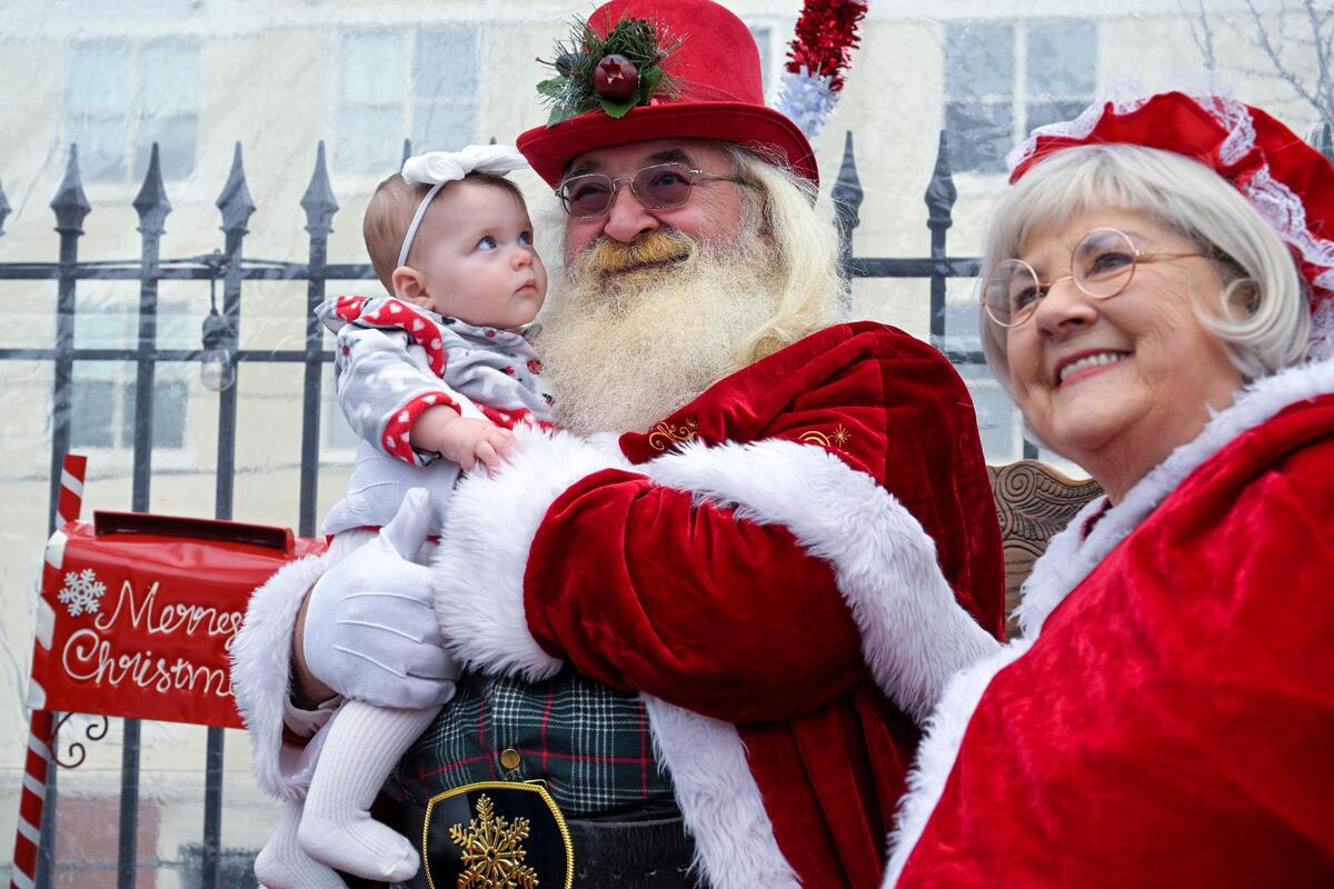 Seven-month-old Brynlee Audley got her first glimpse of Santa and Mrs. Claus, also known as Richard and Patricia Jones, during Brunch and Cookies in the Wonder Dome on Dec. 17 at the OurHouseKC restaurant, 1815 W. 39th St. in Kansas City. Brynlee made the visit with her parents Jacquie and John Audley of Overland Park.