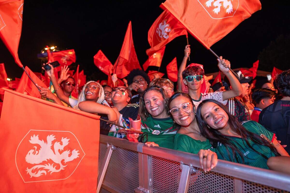 Dutch fans wave their flags and cheer as they celebrate their team during the Bij Oranje Party at Fan Fest on Wednesday, June 24, 2026.
