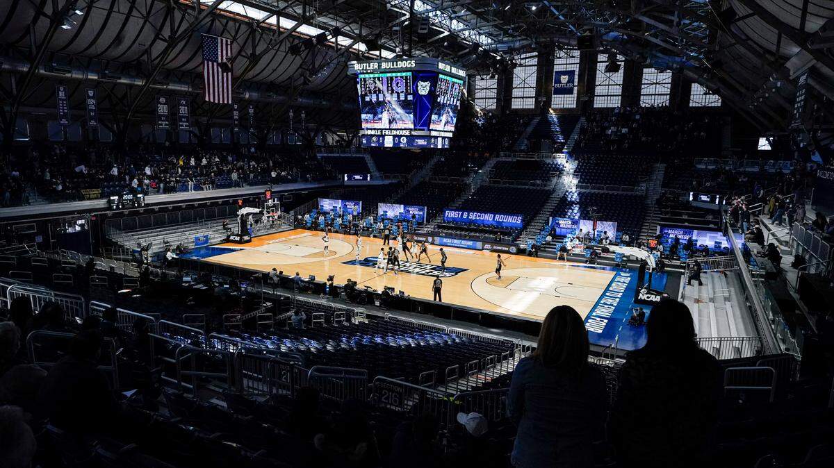 Colorado tips off with Georgetown to start the first half of a first-round game in the NCAA men’s college basketball tournament at Hinkle Fieldhouse in Indianapolis, Saturday, March 20, 2021. Restrictions due to the COVID-19 pandemic have limited crowds, reduced interactions and created an abnormal NCAA experience for those involved. (AP Photo/Michael Conroy)