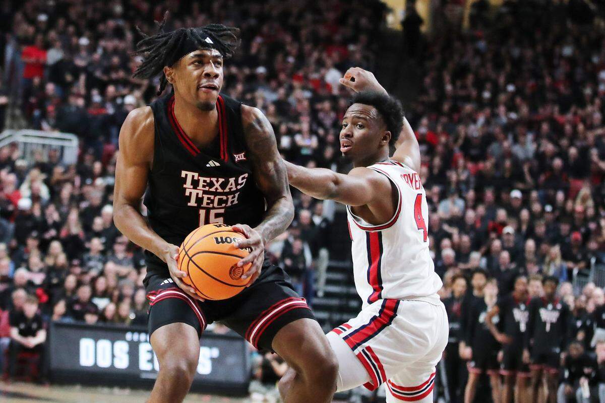 Texas Tech Red Raiders forward JT Toppin (15) shoots against Houston Cougars guard LJ Cryer (4) in the first half at United Supermarkets Arena on Feb. 24, 2025.