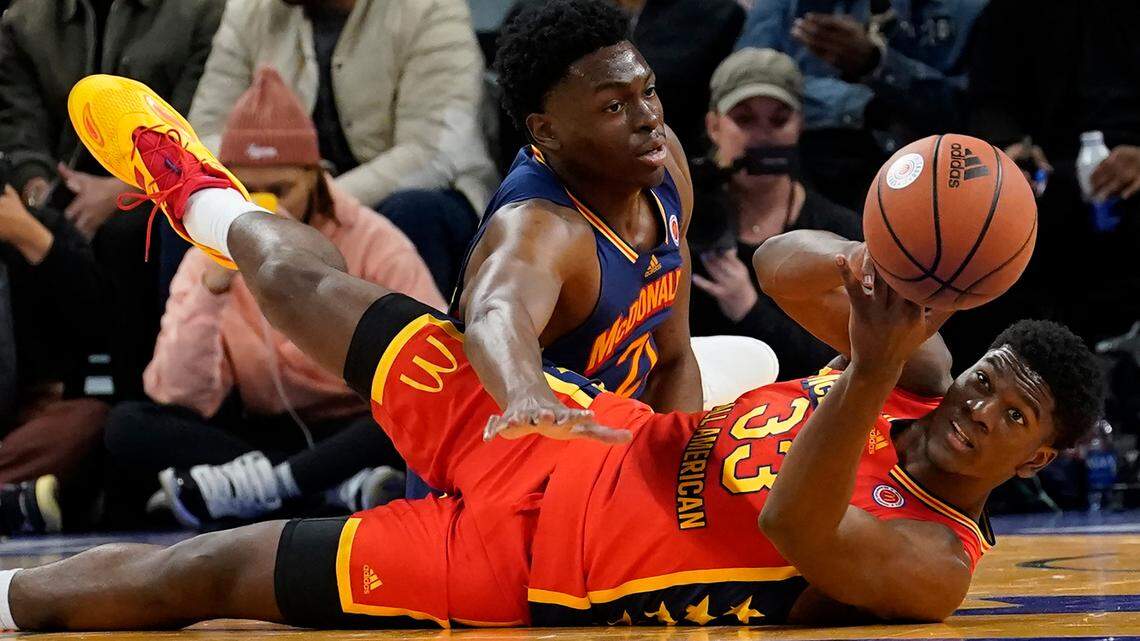 Future Kansas Jayhhawks center Ernest Udeh of the East team (top) tried to get a loose ball from Kijani Wright of the West team during the McDonald’s All-American Boys basketball game Tuesday in Chicago.