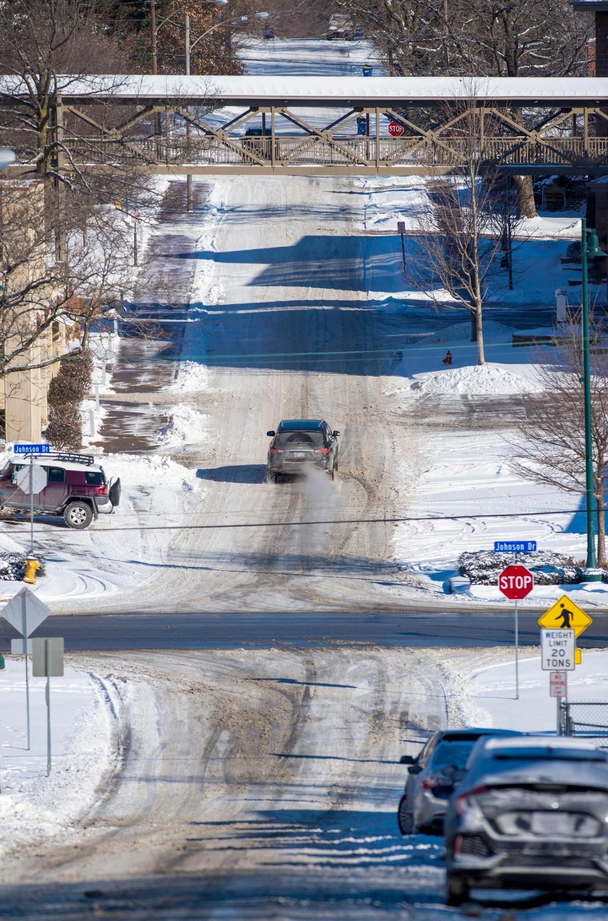 A driver navigated a snow-packed, slick Reeds road in sub-zero temperatures on Tuesday, Feb, 16, in Mission, Kansas.