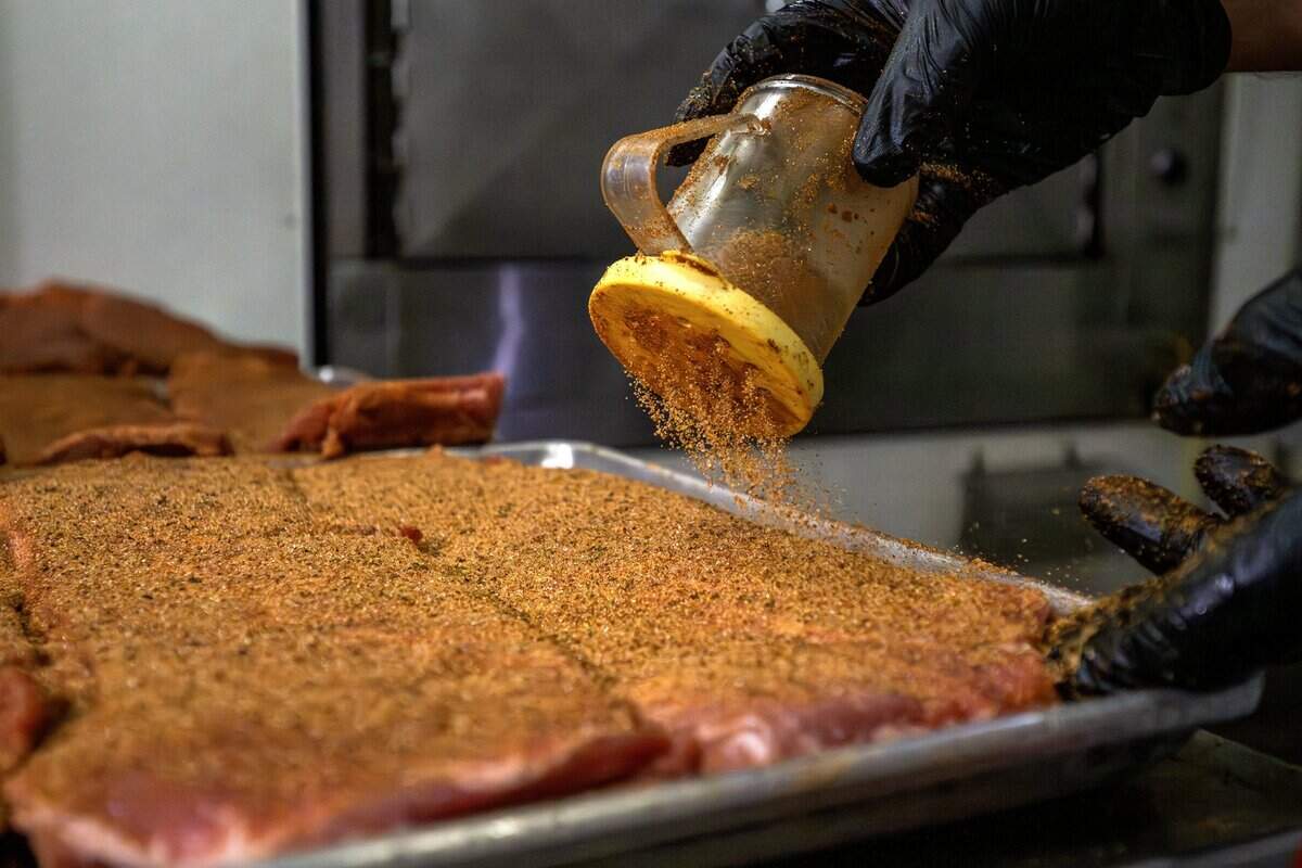 Ribs are seasoned at Joe's KC BBQ on Thursday, April 30, 2026, in Kansas City, Kansas.