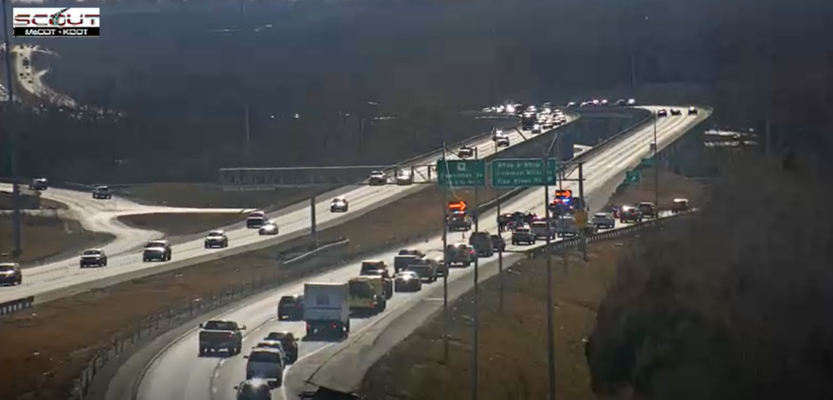 U.S. 71 southbound lanes were closed in Kansas City on Wednesday, Jan. 7, due to a homicide probe by KCPD near Blue River Road; KC Scout cameras show police activity and a diversion at East 75th Street.
