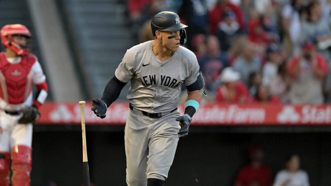 New York Yankees center fielder Aaron Judge (99) heads to first on a two-run home run scoring right fielder Juan Soto (22) in the fourth inning against the Los Angeles Angels at Angel Stadium.