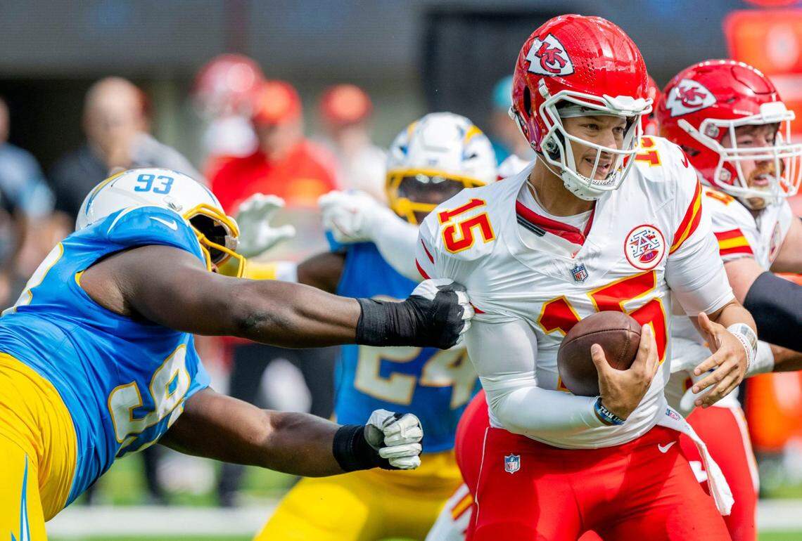Los Angeles Chargers defensive tackle Otito Ogbonnia (93) pressures Kansas City Chiefs quarterback Patrick Mahomes (15) in the first half at SoFi Stadium in Inglewood, California, on Sunday, Sept. 29, 2024.