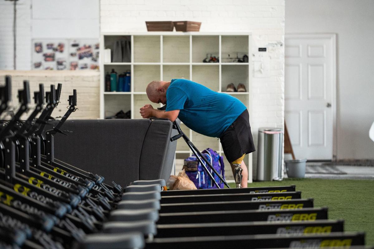 Daniel Bufford rests in between his exercise routines. Bufford joined the Adaptive Athletes in Motion Program in April 2023 nearly six months after losing his leg. With extended delays in his physical therapy, Bufford says he connected with Josh Snyder and started learning how to walk again.