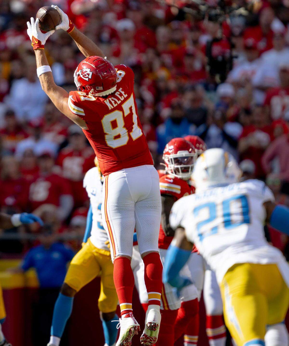 Kansas City Chiefs tight end Travis Kelce (87) catches a pass against the Los Angeles Chargers during an NFL football game at GEHA Field at Arrowhead Stadium on Sunday, Oct. 22, 2023, in Kansas City.