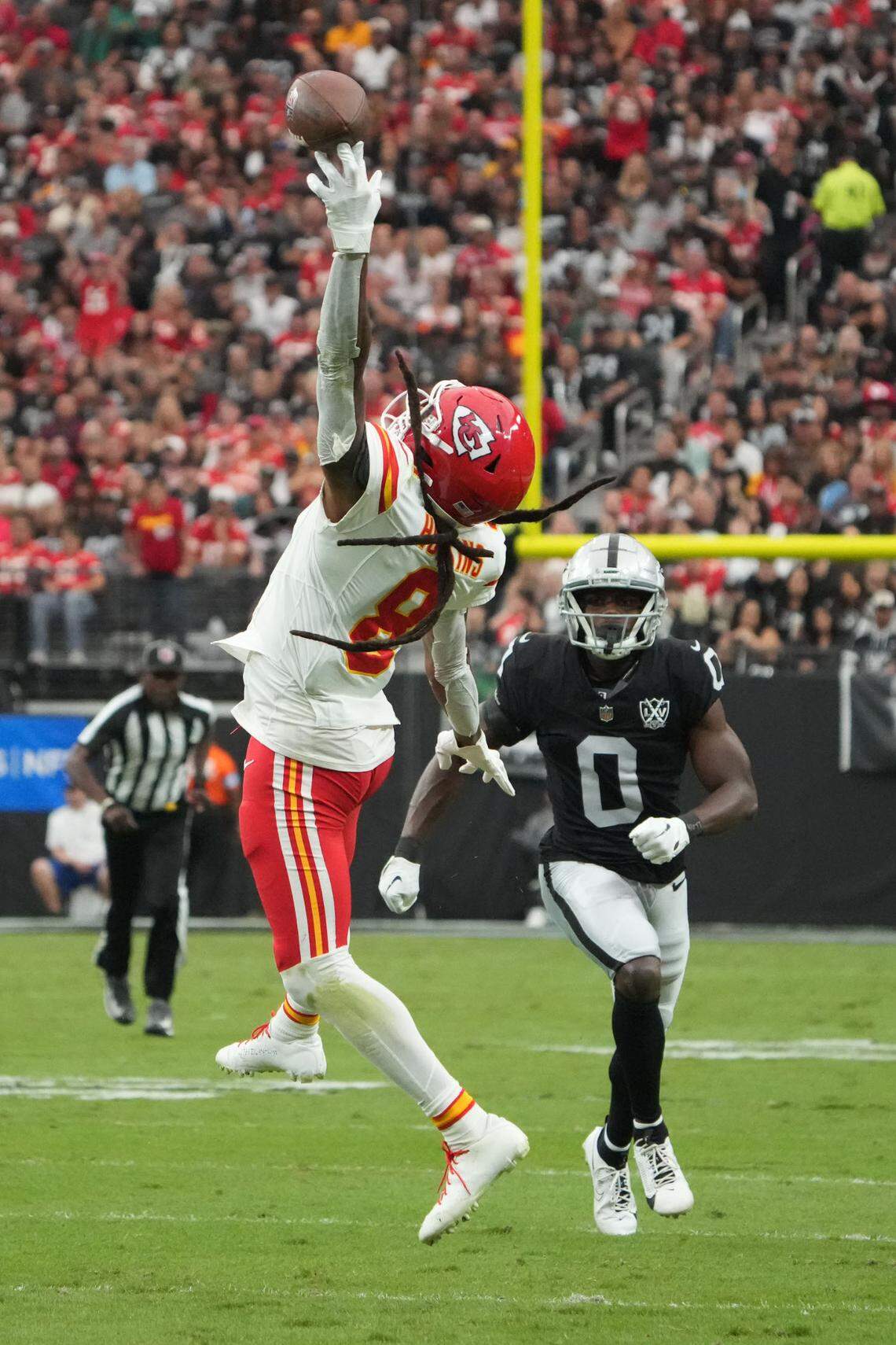 Kansas City Chiefs receiver DeAndre Hopkins leaps for a pass against Las Vegas Raiders cornerback Jakorian Bennett during Sunday’s game at Allegiant Stadium Oct. 27, 2024 in Paradise, Nevada.