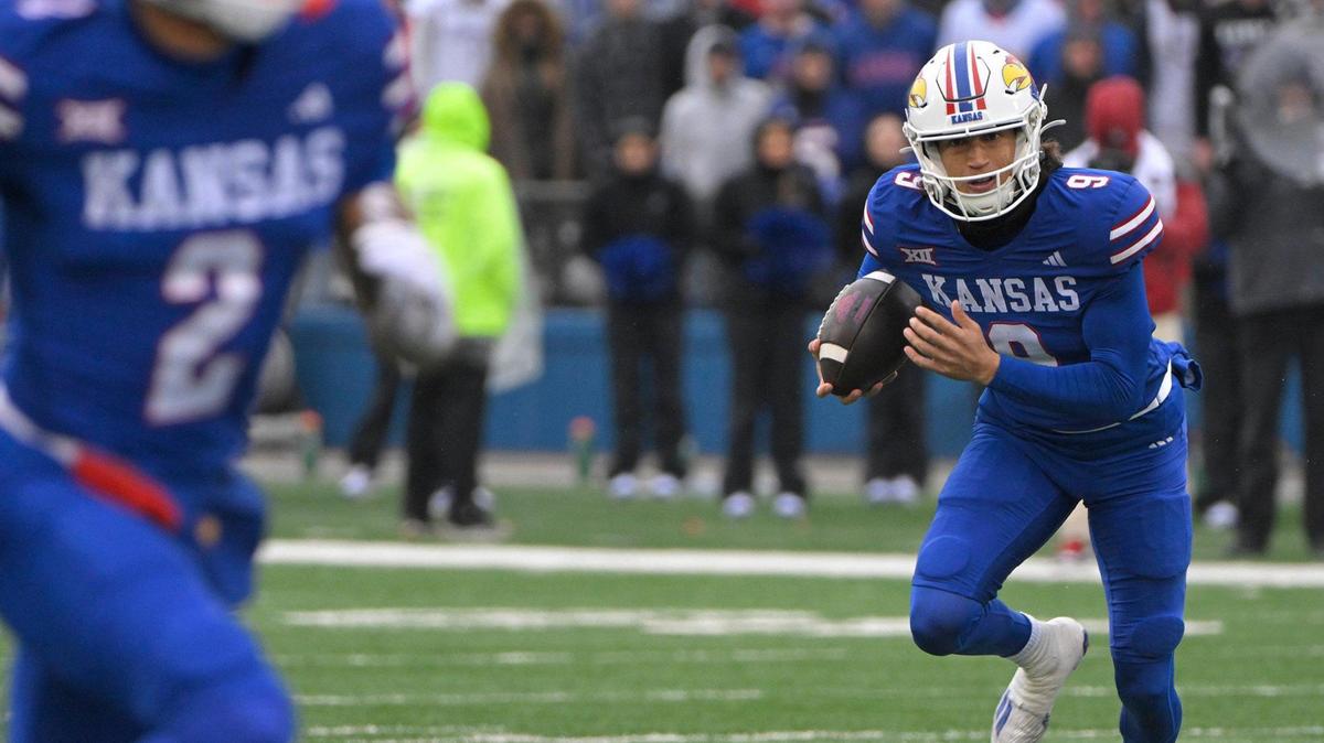 Kansas Jayhawks quarterback Jason Bean (9) runs for a 38-yard touchdown in the second half on Saturday, Oct. 28, 2023, at David Booth Kansas Memorial Stadium in Lawrence.