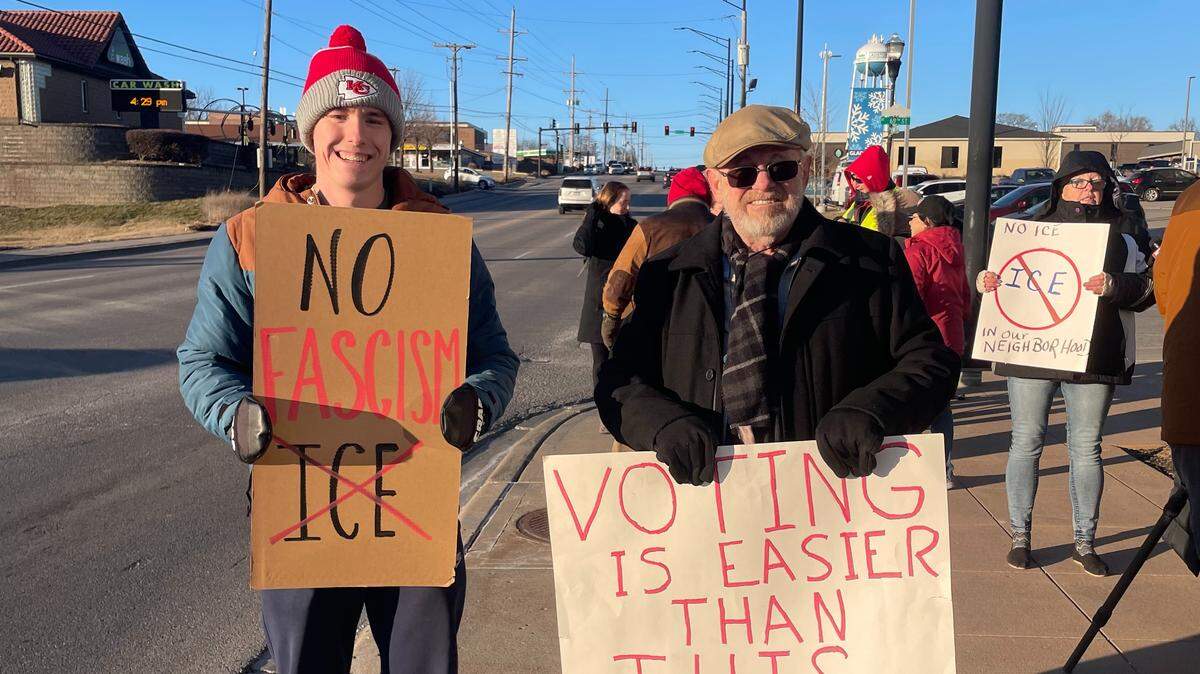 Protesters hold signs reading “No Facism” and “Voting Is Easier Than This” during an anti-ICE protest on the afternoon of Jan. 19, 2026, in Gladstone.
