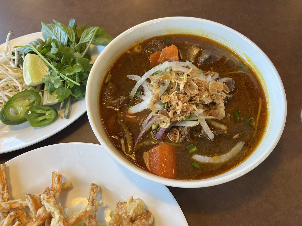 Vietnam Cafe’s Phở Bò Kho (beef stew with noodles; $14.75) which is served with fresh bean sprouts, basil, cilantro, jalapeno peppers and lime.
