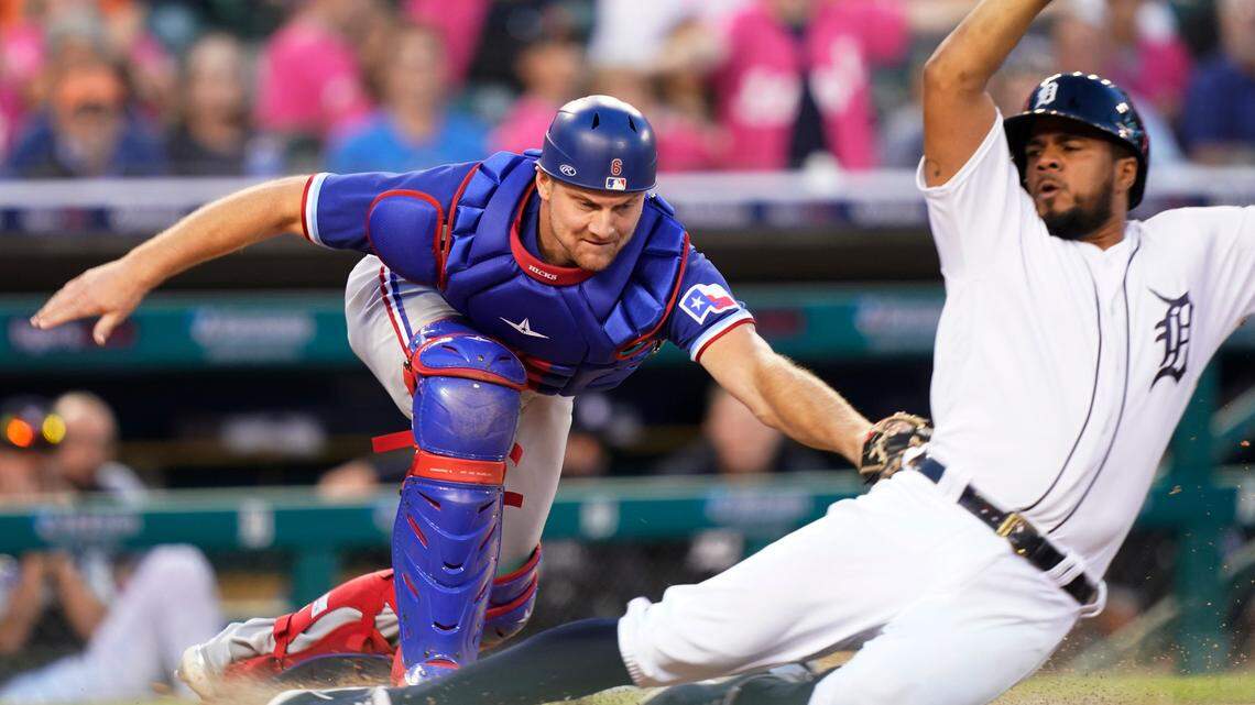 Texas Rangers catcher John Hicks (6) tags out Detroit Tigers’ Jeimer Candelario during the sixth inning of a baseball game, Wednesday, July 21, 2021, in Detroit. Candelario was attempting to score from second on a single by teammate Harold Castro to left field. (AP Photo/Carlos Osorio)