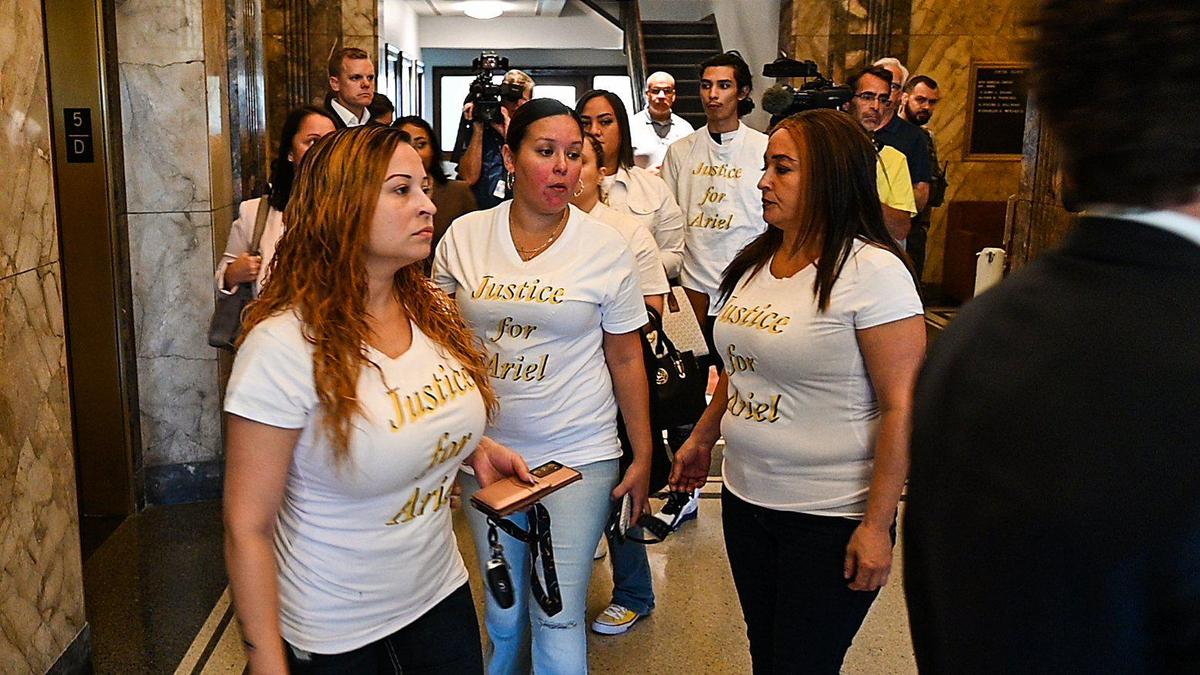 Felicia Miller, left, the mother of Ariel Young who was severely injured when the pickup truck former Kansas City Chiefs assistant coach Britt Reid was driving while intoxicated slammed into the car Ariel was in in 2021, leaves the courtroom at the Jackson County Courthouse Monday, September 12, 2022, after hearing Reid plead guilty to driving while intoxicated.