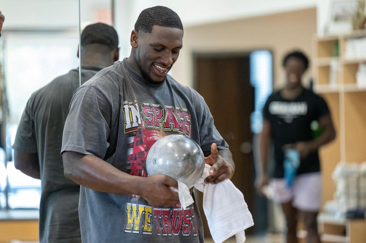 Chiefs defensive tackle Tershawn Wharton wipes down a ball he used in a pilates class at Pilates By Kahley on Tuesday, Oct. 29, 2024, in Overland Park.