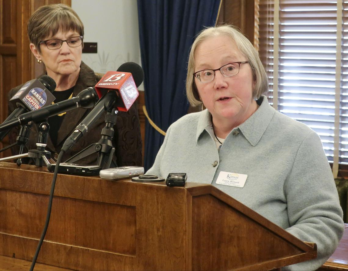 Kansas Gov. Laura Kelly (left), with Kansas Department for Children and Families Secretary Laura Howard, at a news conference earlier this year.