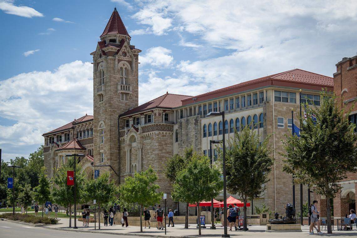 Students returned to campus and walked past Dyche Hall on the first day of classes on Monday, August 18, 2025, at the University of Kansas in Lawrence, Kansas.