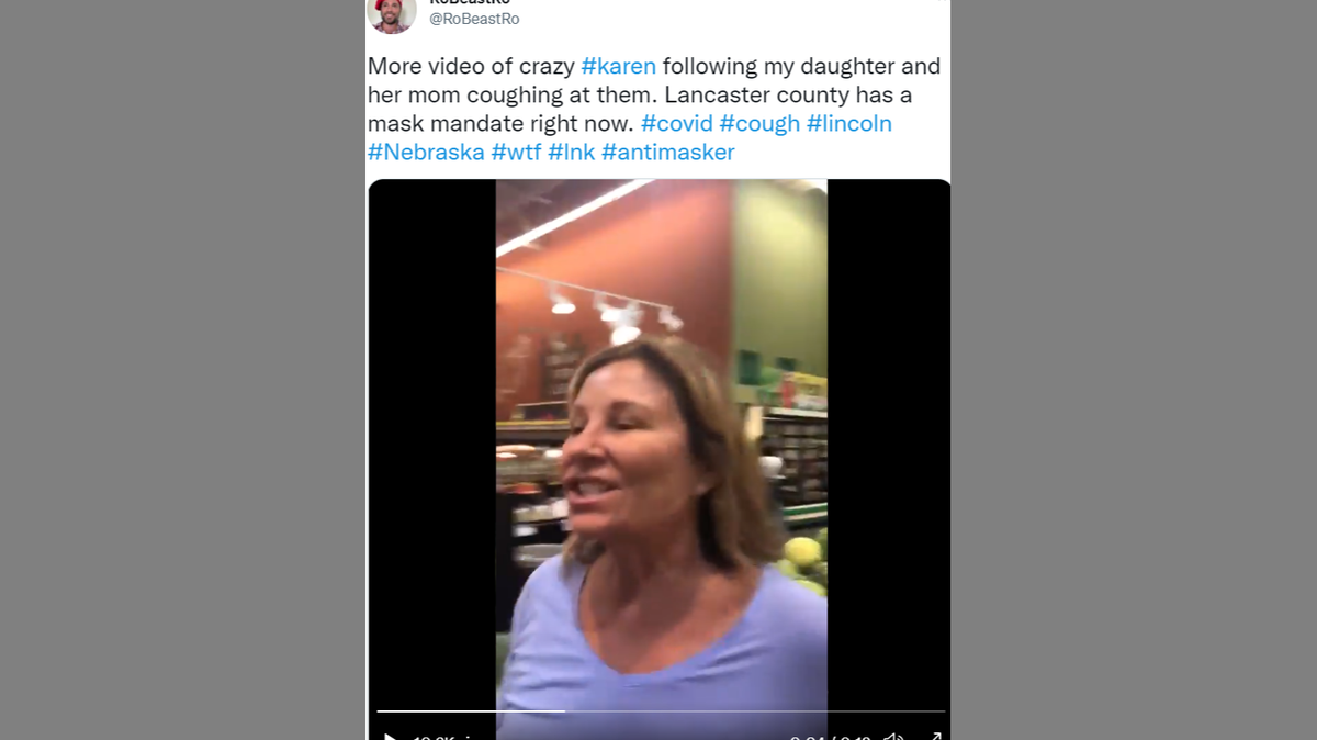 A woman seen on viral video coughing on a mother and daughter wearing masks at a Lincoln, Nebraska grocery store has been fired from her job.