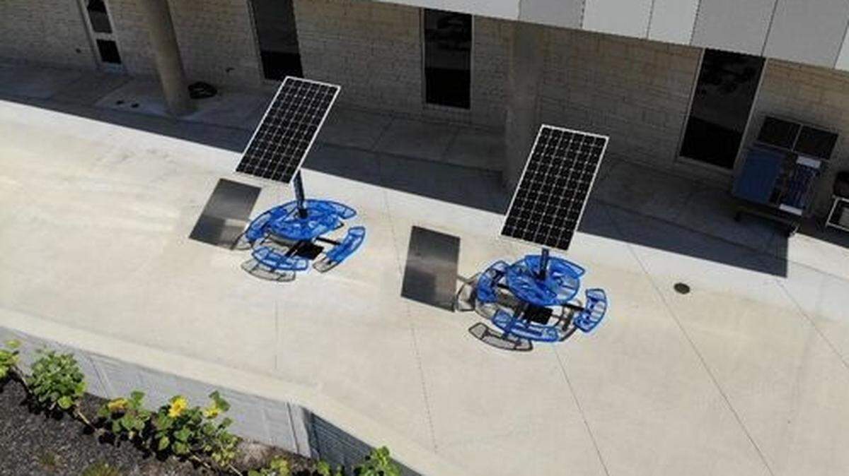 Each charging table at Olathe West has its own solar panel.