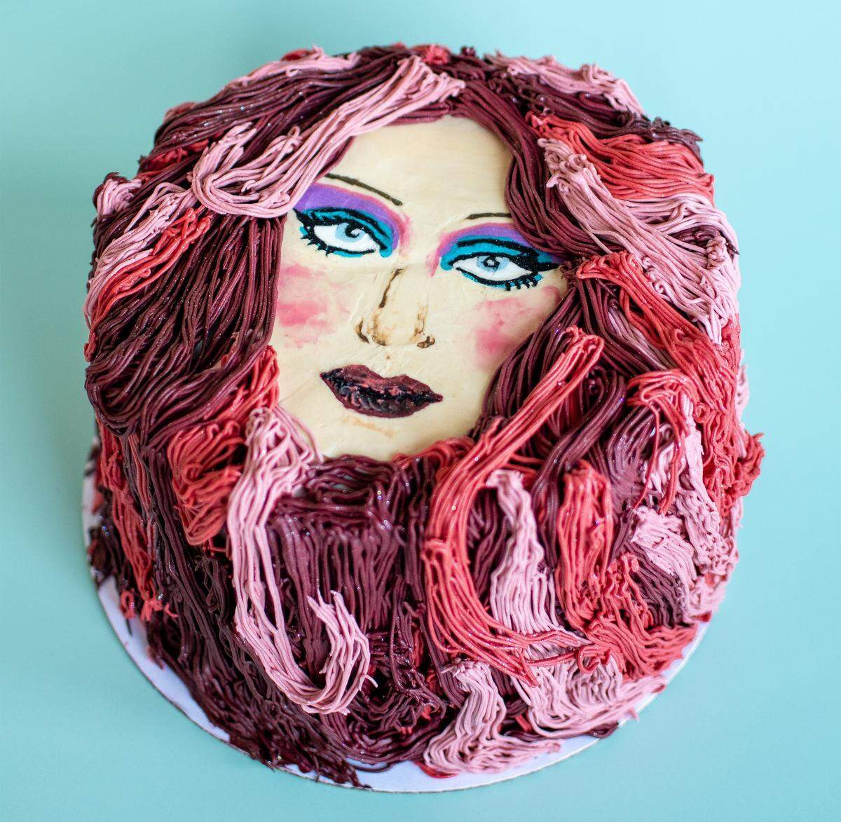 McLain's Bakery crafted and gifted a one-of-a-kind Chappell Roan cake, inspired by the mural painted by Jared Horman and Beauty From Light, to the artists. The mural is painted on a building facing the parking lot of Hamburger Mary's, 3700 Broadway Blvd. The cake, featuring long strands of icing to mimic the singer's flowing locks, was showcased in photos shared by the bakery on Facebook and Threads.