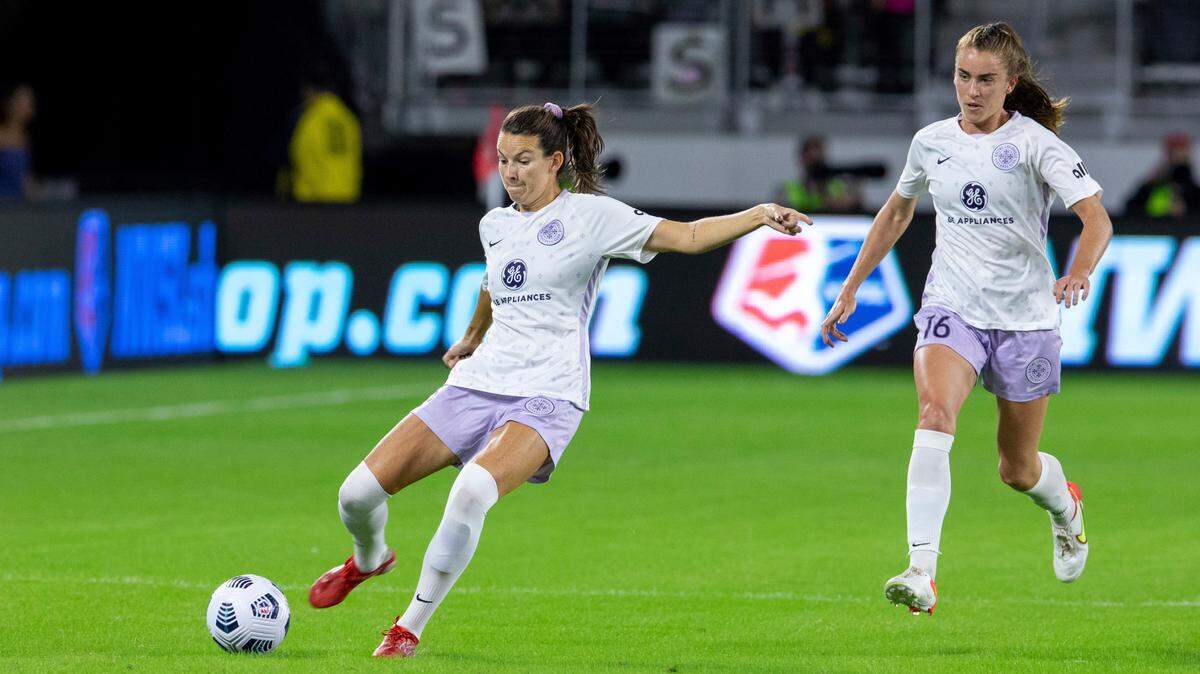Racing Louisville FC forward Cece Kizer (5) dribbles the ball down the field alongside her teammate Racing Louisville FC defender Julia Ashley (16) during the first half of an NWSL soccer match in Washington, on Saturday, Oct. 9, 2021. (AP Photo/Amanda Andrade-Rhoades)