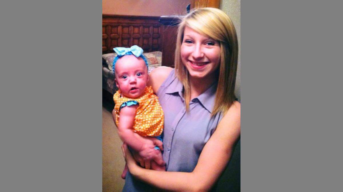 Abigail Edwards is seen with her baby cousin. Edwards, 20, was killed last week by gunfire that was the result of a feud she had no part in, relatives said.