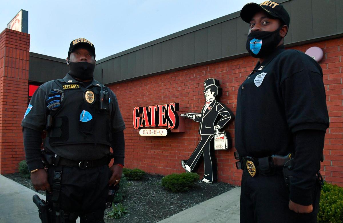 Demarcus Johnson-Bey, left, and Omari Tatum are co-owners of Black Hawk Security & Neighborhood Watch.