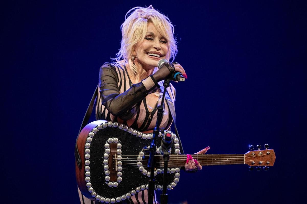 Dolly Parton speaks to the audience before performing the song “Try” during the implementation event of Imagination Library at White Theatre at the Jewish Community Center on Monday, Aug. 14, 2023, in Overland Park.