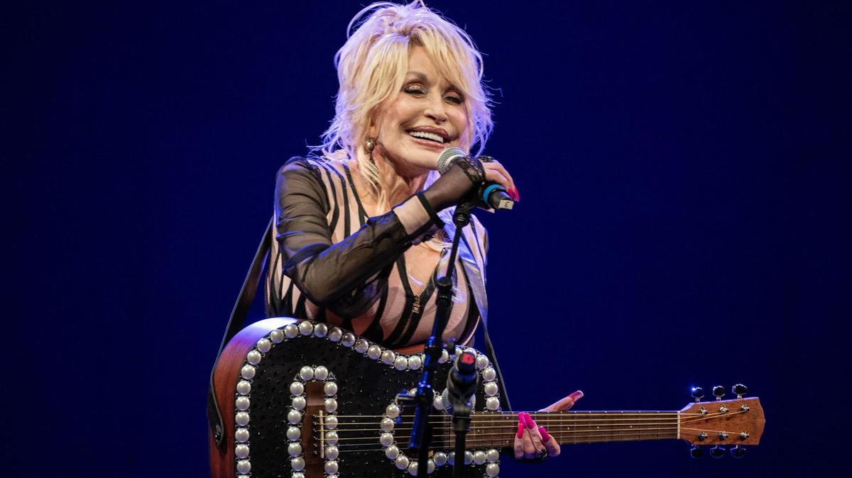 Dolly Parton performed in Missouri and Kansas to celebrate statewide implementation of her program delivering free books to kids. Missouri is slashing state funding for the Imagination Library, which will halt enrollment on July 1.