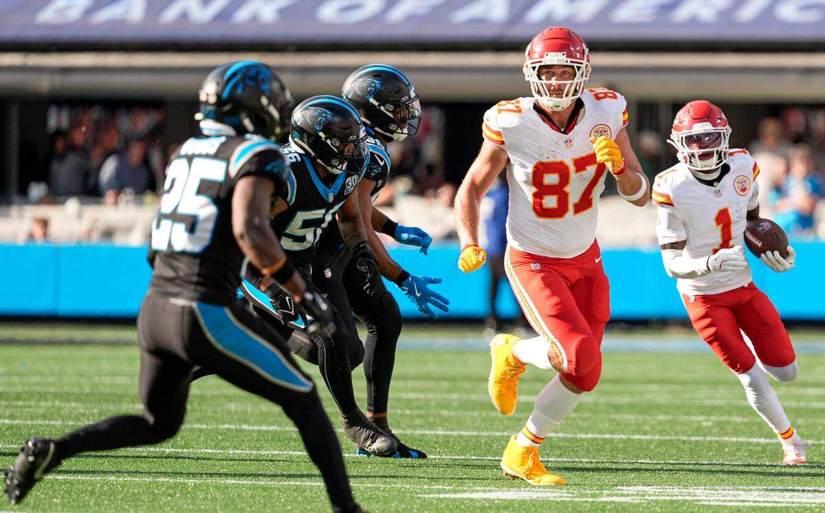 Kansas City Chiefs wide receiver Xavier Worthy (1) follows the block by tight end Travis Kelce (87) against the Carolina Panthers during the second quarter at Bank of America Stadium.