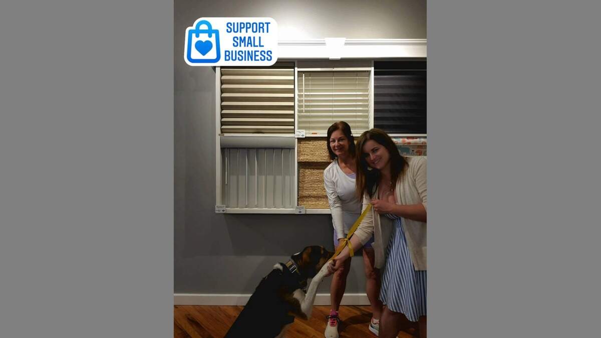 Owner Debbie Stoddard, left, is joined by Courtney Stoddard Laufketter, vice president of sales and marketing. This was their “Tied Together” photo for Facebook. Burt Macklin, Laufketter’s dog, andis the business’ head of customer service